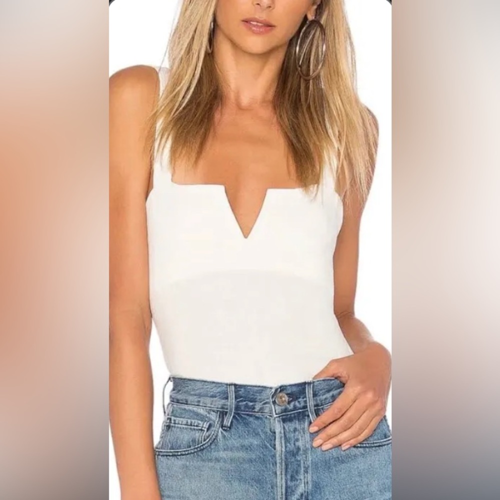 Free People White bodysuit. New with tags on!
